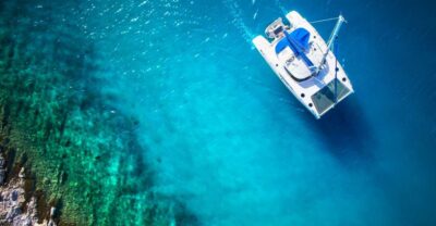 From Ornos: Mykonos Delos Catamaran Cruise with Meal & SUP - Delos from the deck: photos, sailing views, and what’s not included