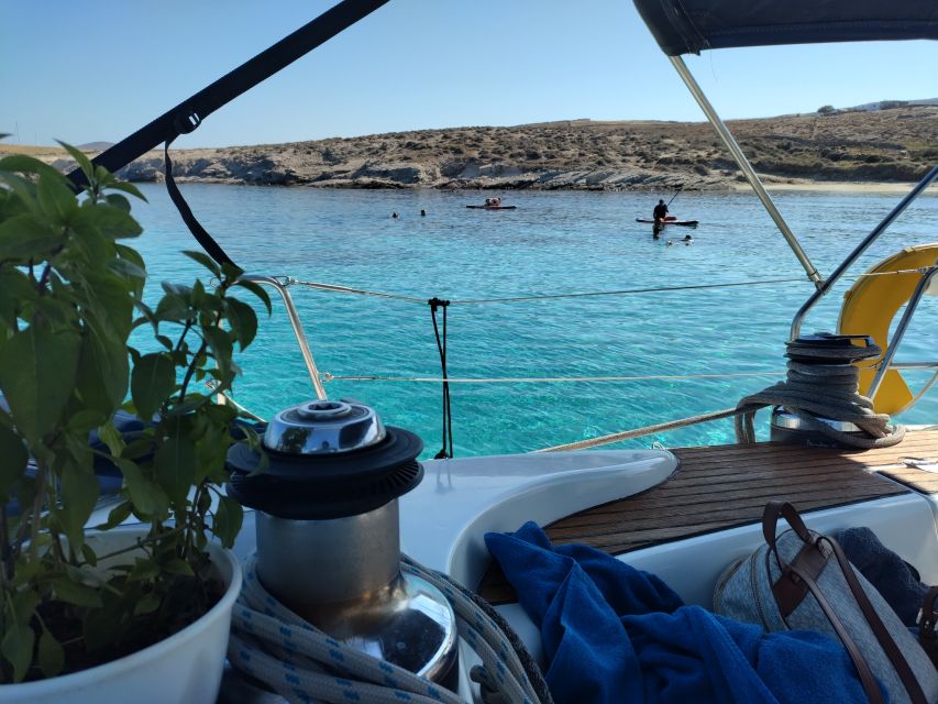 Mykonos: Delos and Rhenia Cruise with Swim and Greek Meal - Lunch afloat: Greek flavors, wine, and not rushing the meal