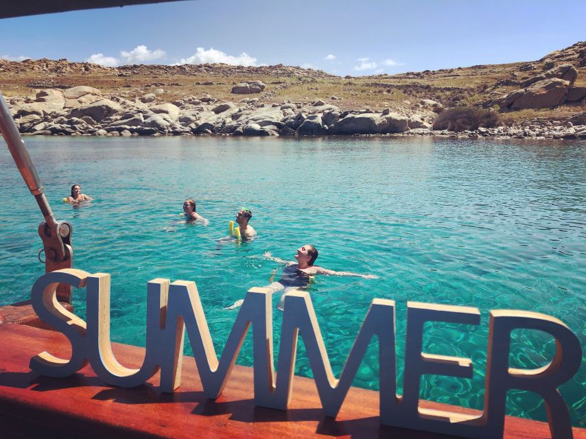 Mykonos: Delos and Rhenia Islands Cruise with BBQ Meal - Rhénia Island: Snorkeling Setup, Clear-Water Swim Time, and BBQ on the Water