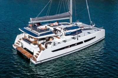 Mykonos: Luxury Catamaran Cruise with Meal, Drinks & Transport - Getting there: pickup, meeting point, and the tender boat reality