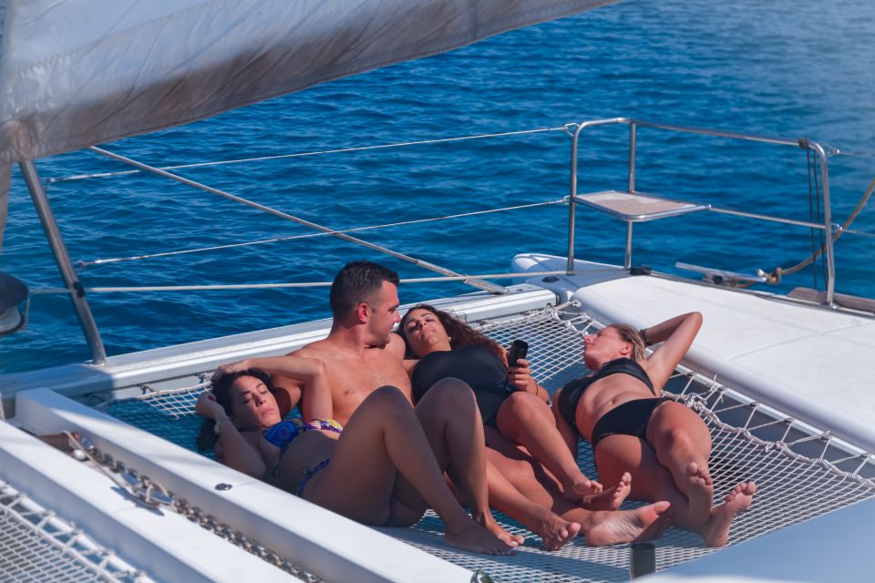 Mykonos: Private Catamaran Cruise w/ Food, Drinks & Transfer - Sailing back with windmills and town views (plus sunset options)