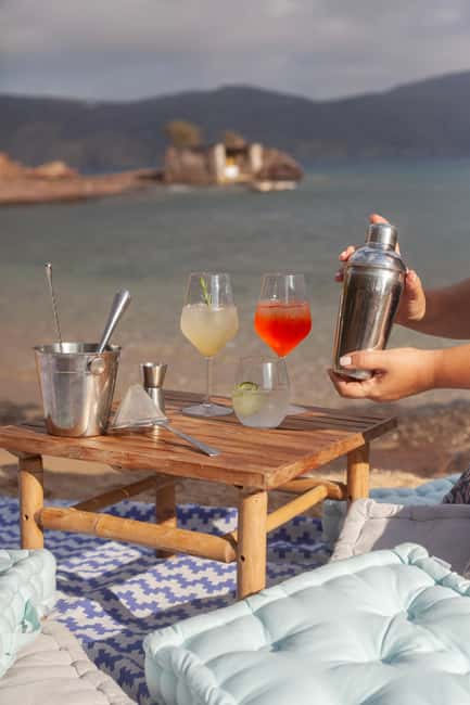 Mykonos: Sunset Cocktail Making Class on a Secluded Beach - Your host and the Greek spirits lesson: Tsipouro, Ouzo, and Mastic